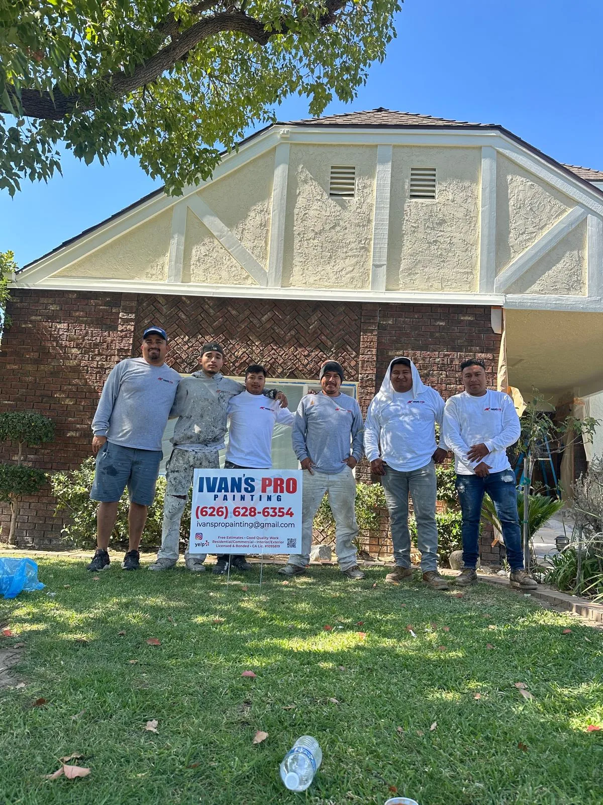 Ivan's Pro Painting crew working on a home exterior