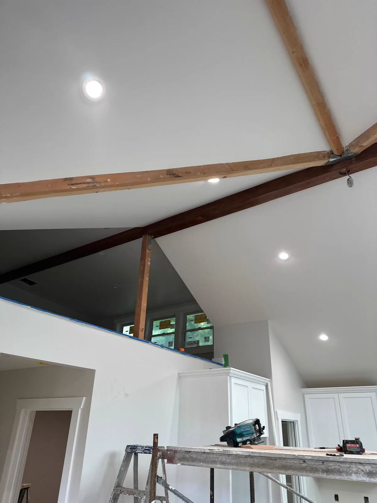 Vaulted Alhambra ceiling painted white with stained exposed wood beams