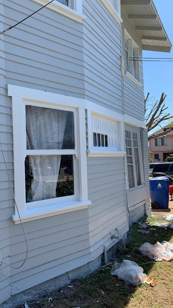 The same Alhambra corner after scraping, priming and repainting in gray with white trim