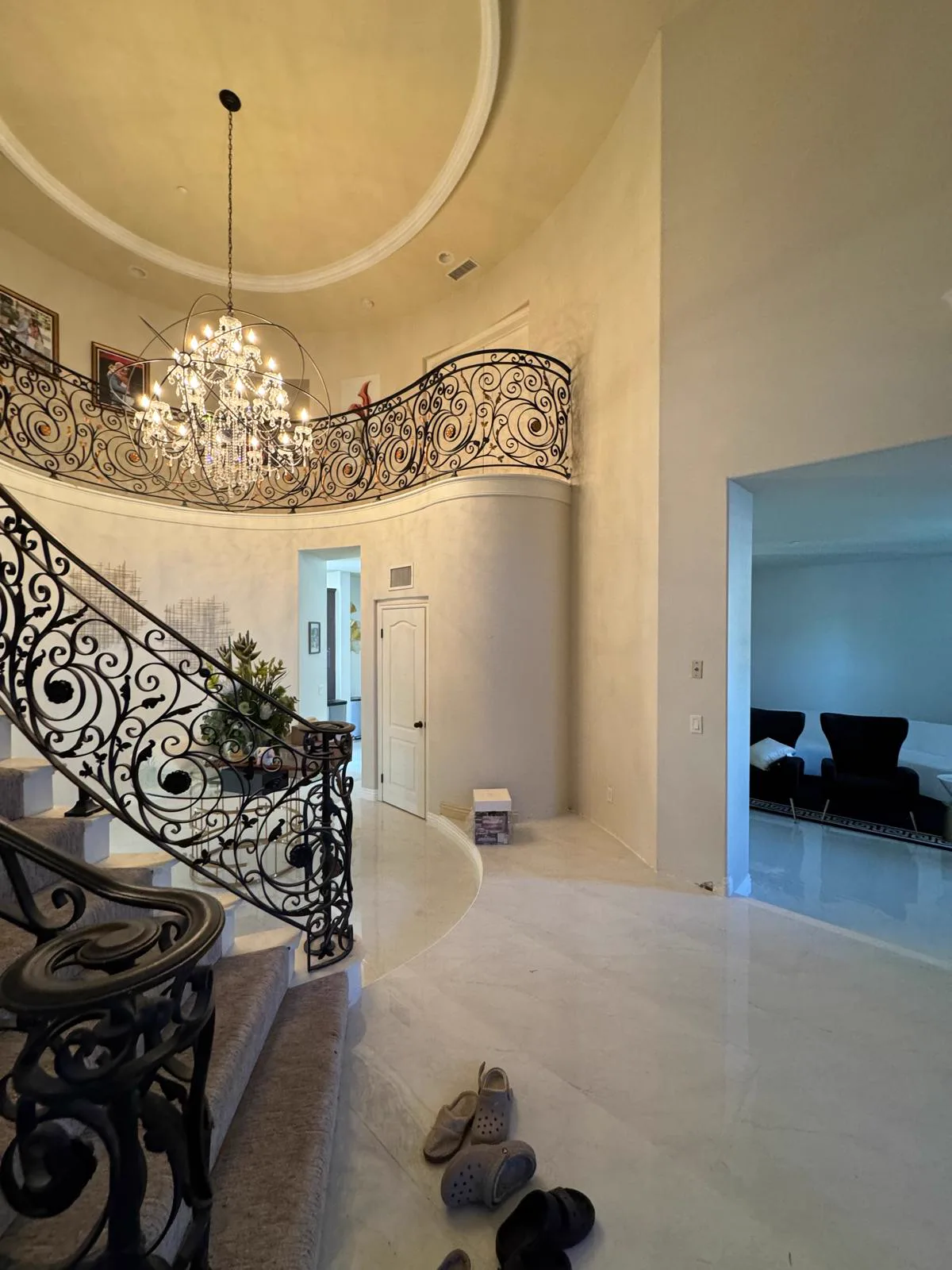Altadena entry with a curved iron staircase, repainted walls and ceiling