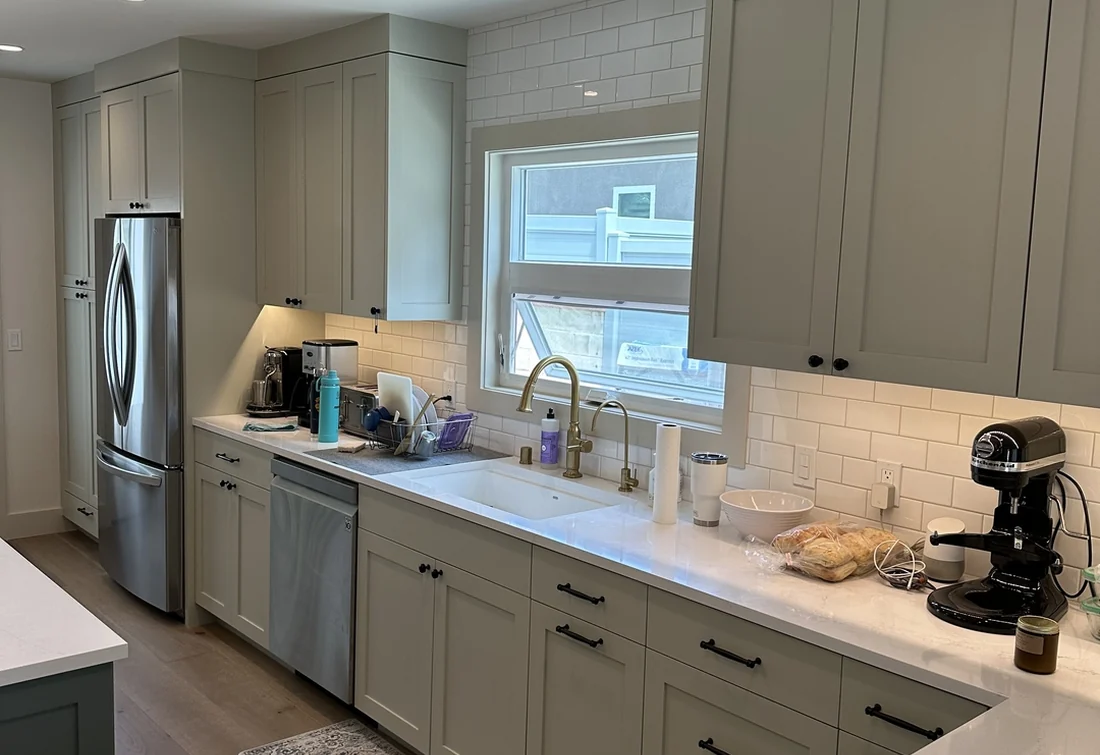 Pasadena kitchen with soft gray painted cabinets and white subway tile