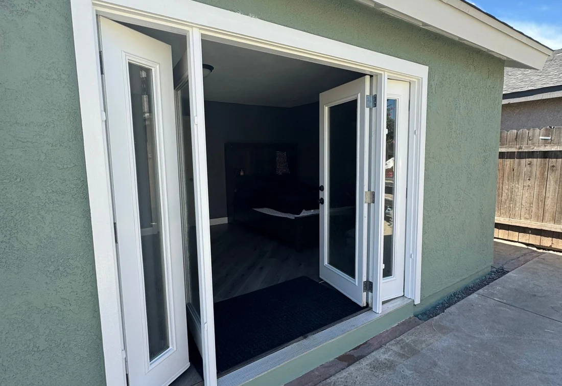 Completed green exterior wall and entry doors