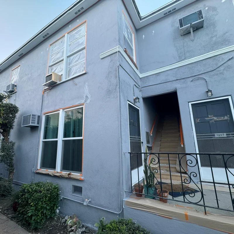 Stucco home exterior after repainting