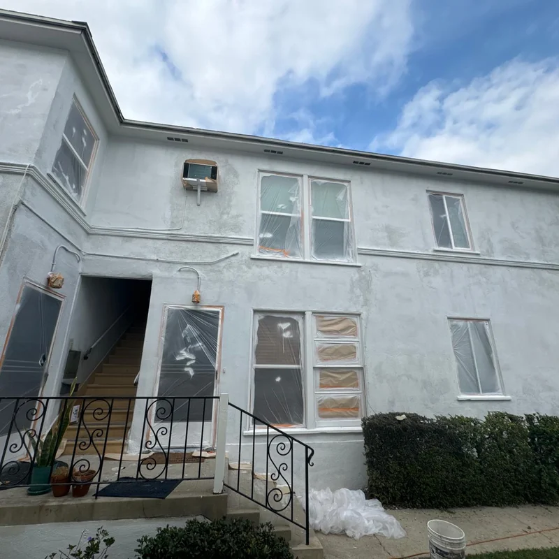 Stucco home exterior before repainting
