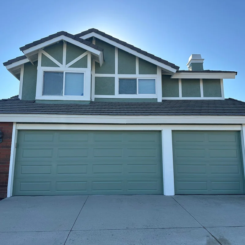 Garage exterior after gray and white repainting