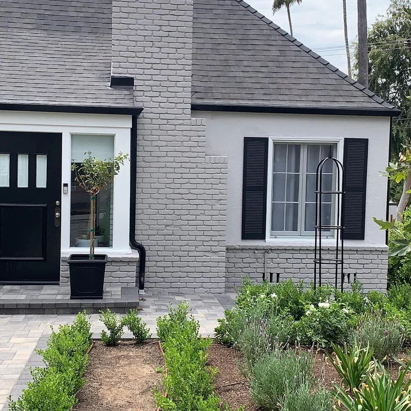 Brick and stucco home after repainting