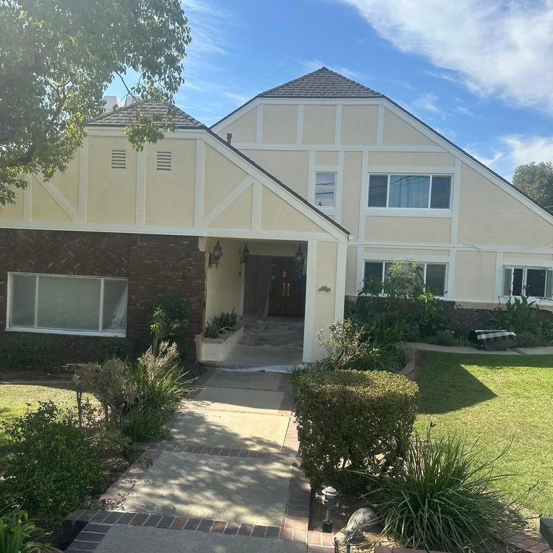 Two-story home after exterior repainting