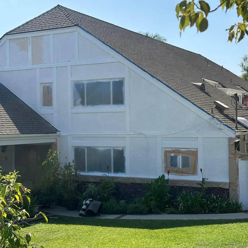 Two-story home before exterior repainting