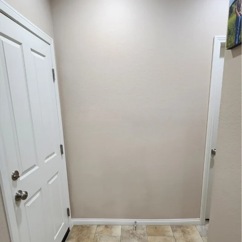 Interior wall after drywall repair and seamless paint matching