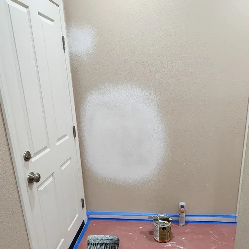 Interior wall before drywall repair and paint matching