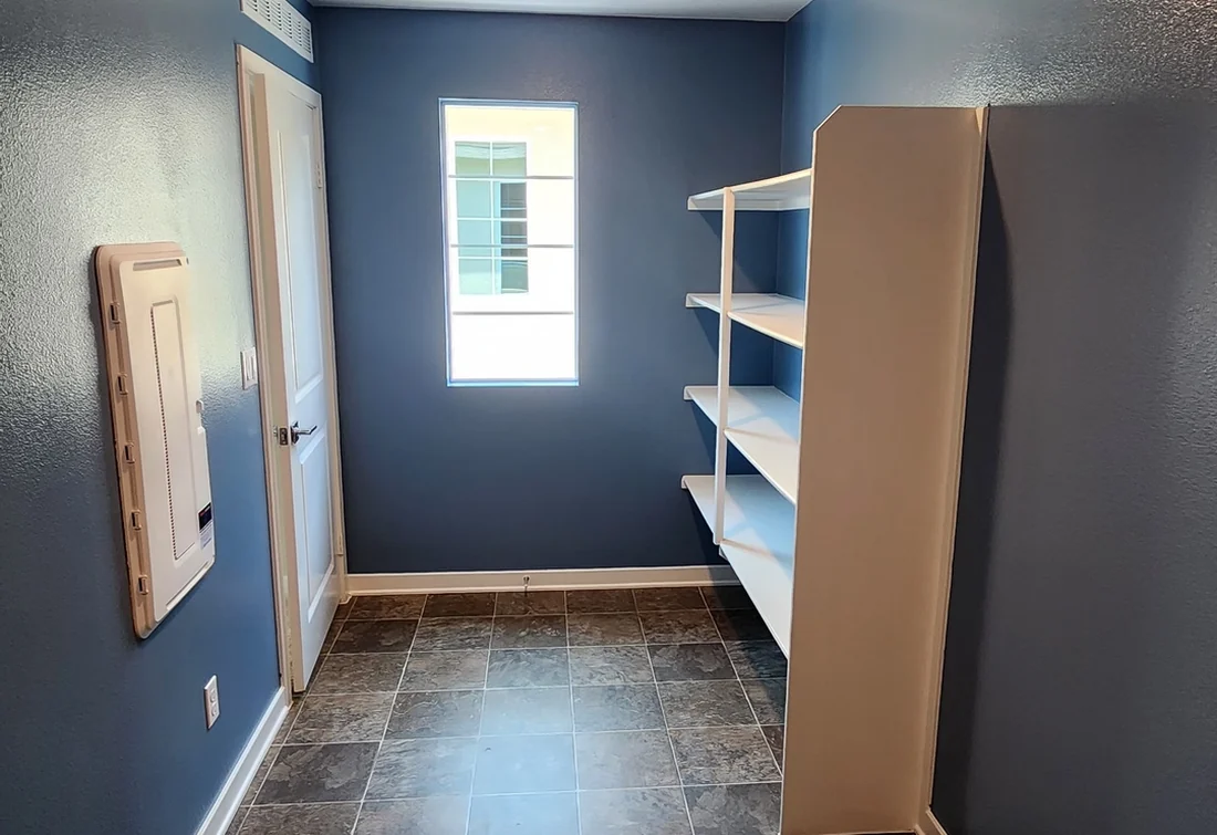 Completed hallway repaint with blue and white walls