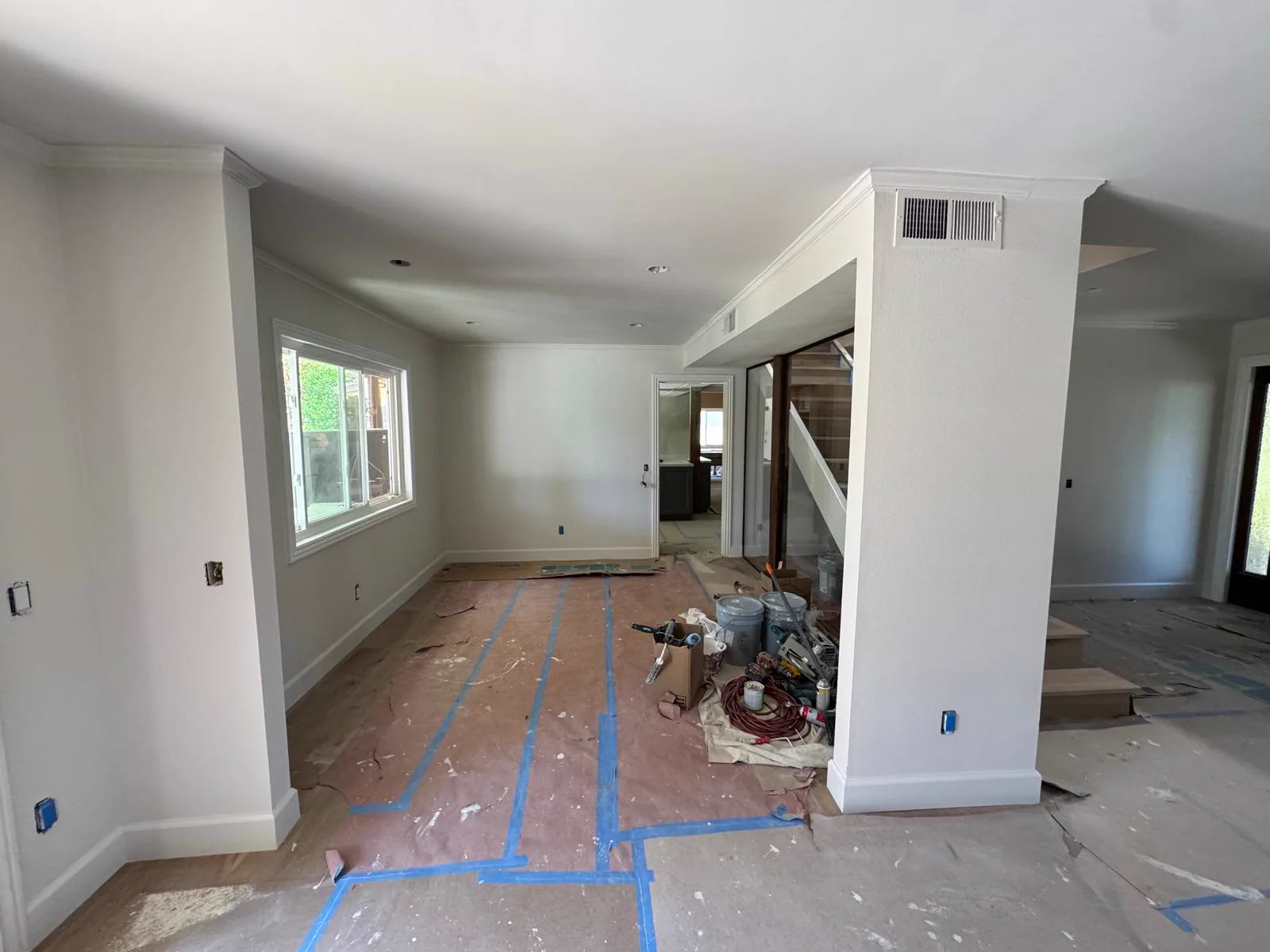 Second view of the same interior with full floor protection in place