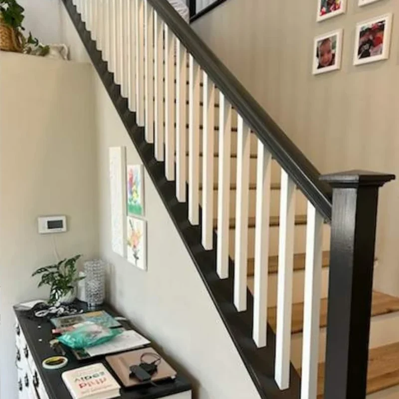Stair railing after black and white refinishing