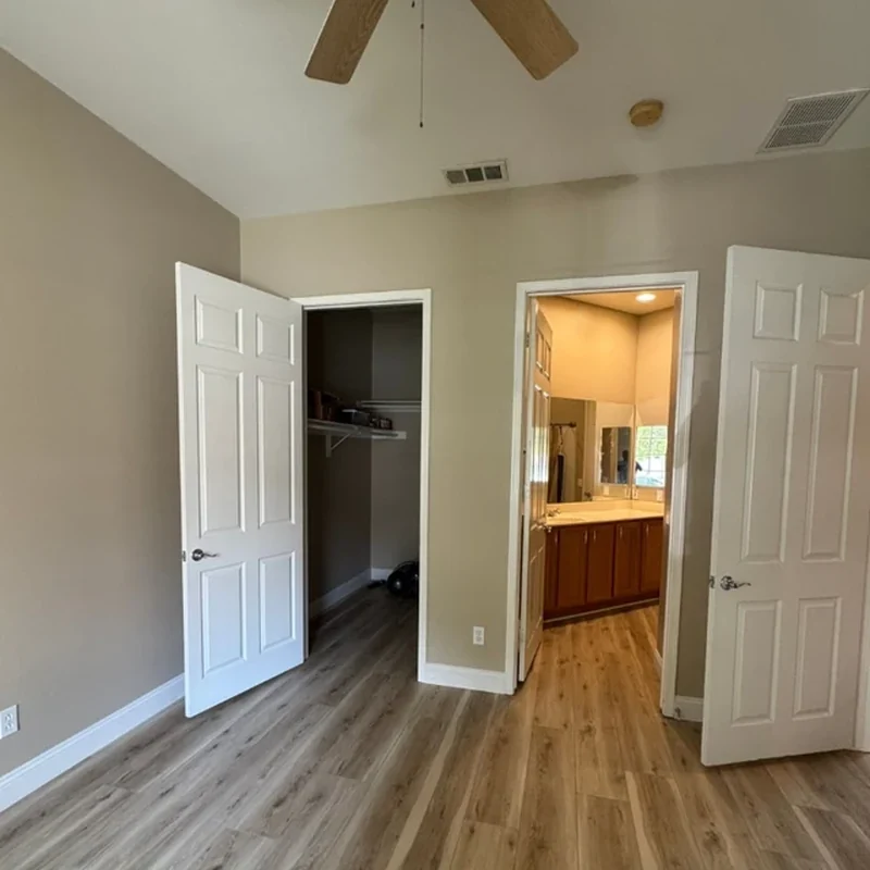 Bedroom after warm neutral wall repainting