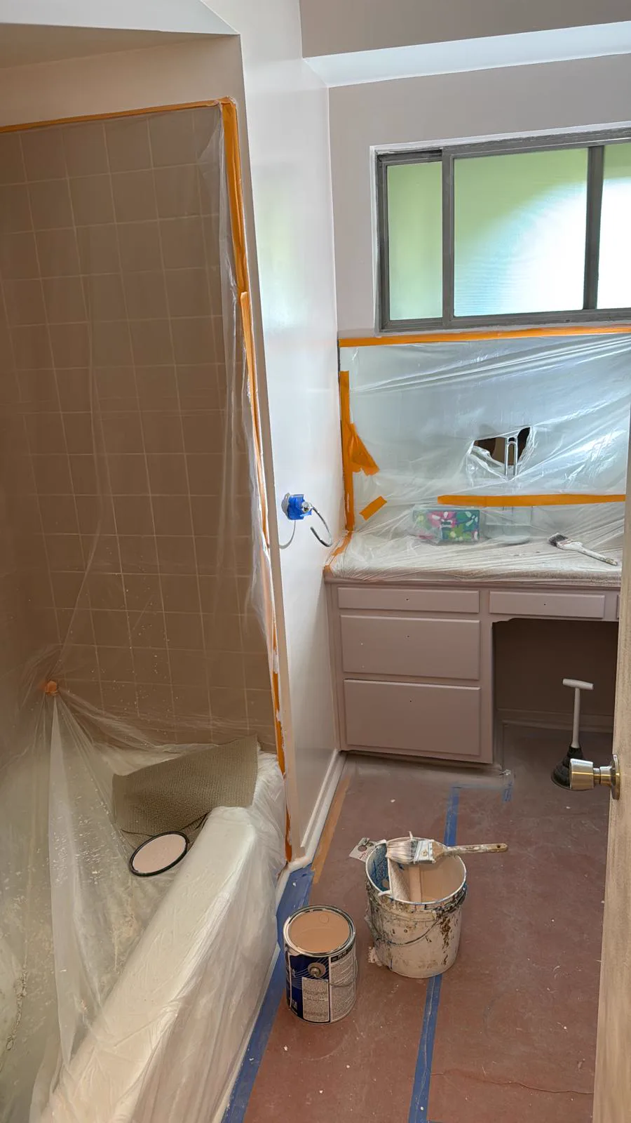 Bathroom cabinetry masked and primed during refinishing, San Gabriel