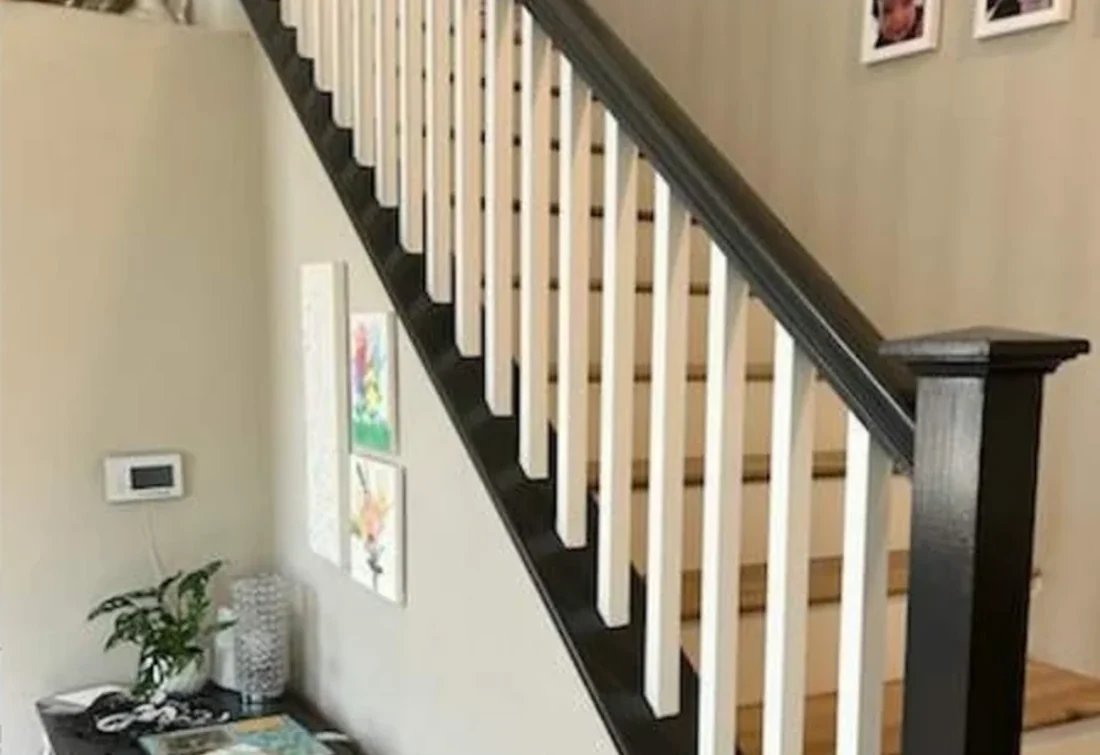Stained handrail and newel post kept dark with balusters painted white, San Gabriel interior repaint