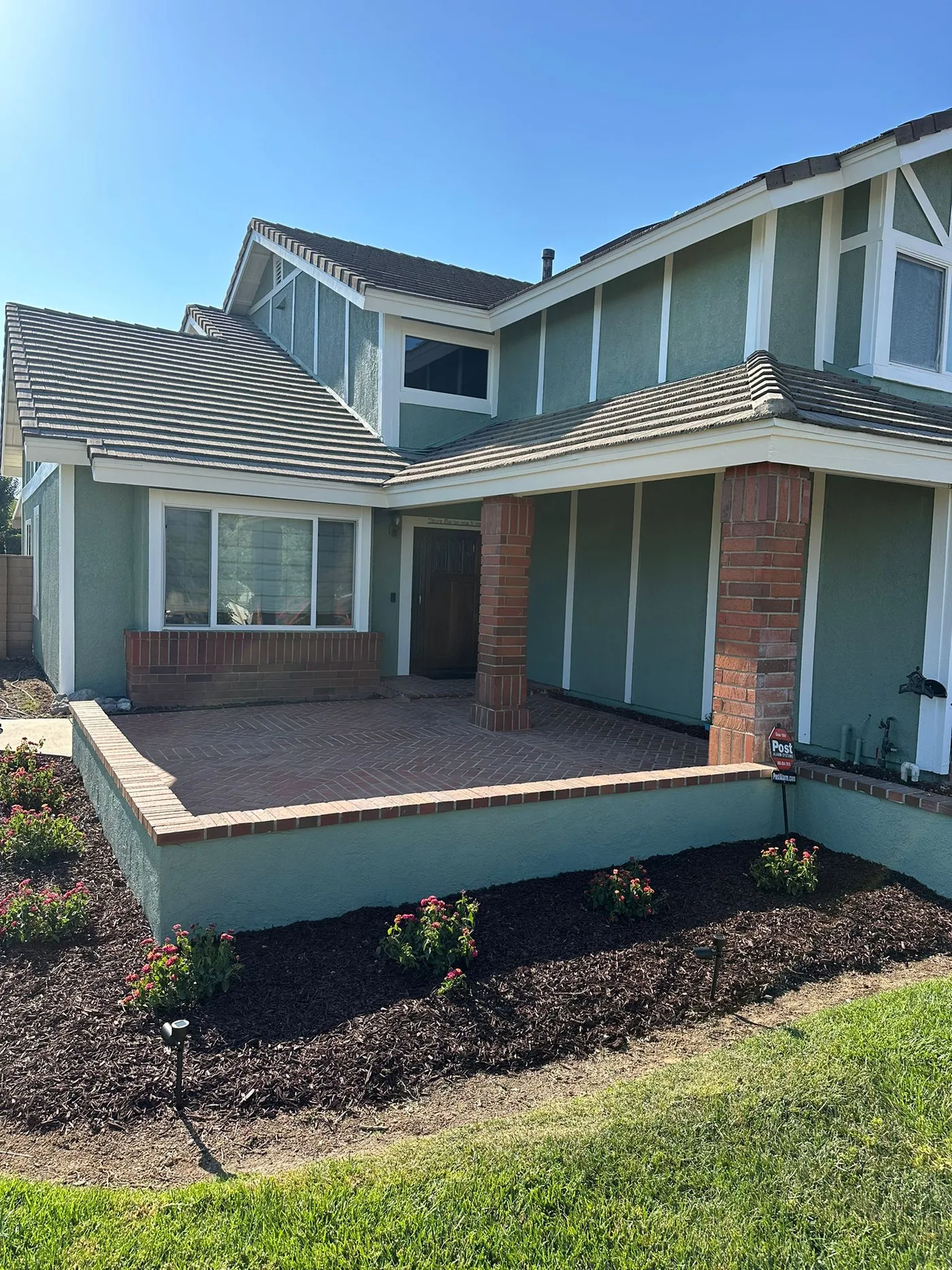 The same South Pasadena home repainted sage green with white trim by Ivan's Pro Painting