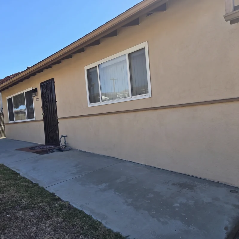 Stucco exterior after texture matching and coating