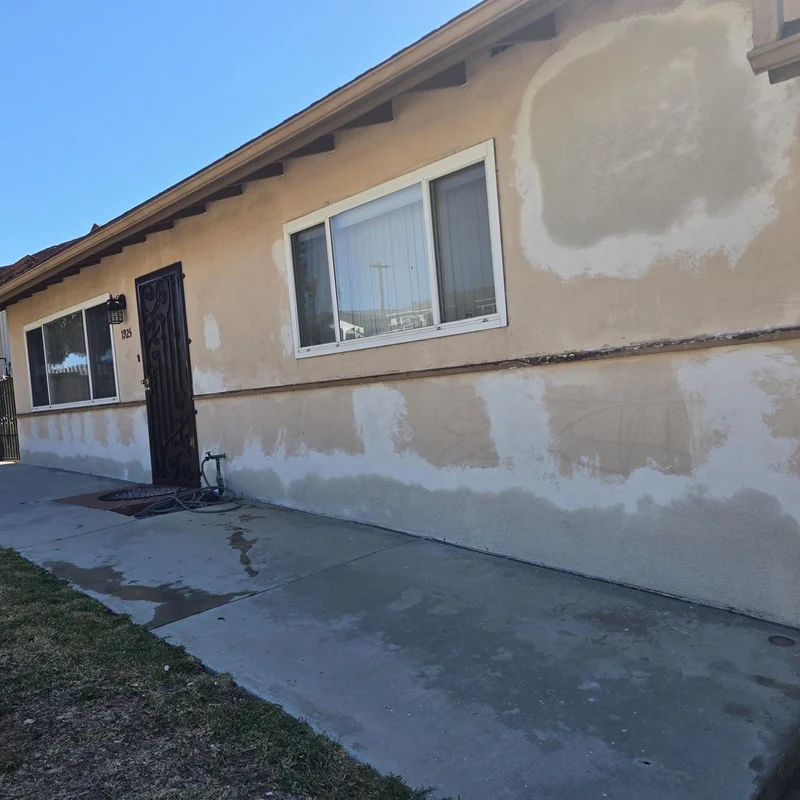 Patched stucco exterior before final coating